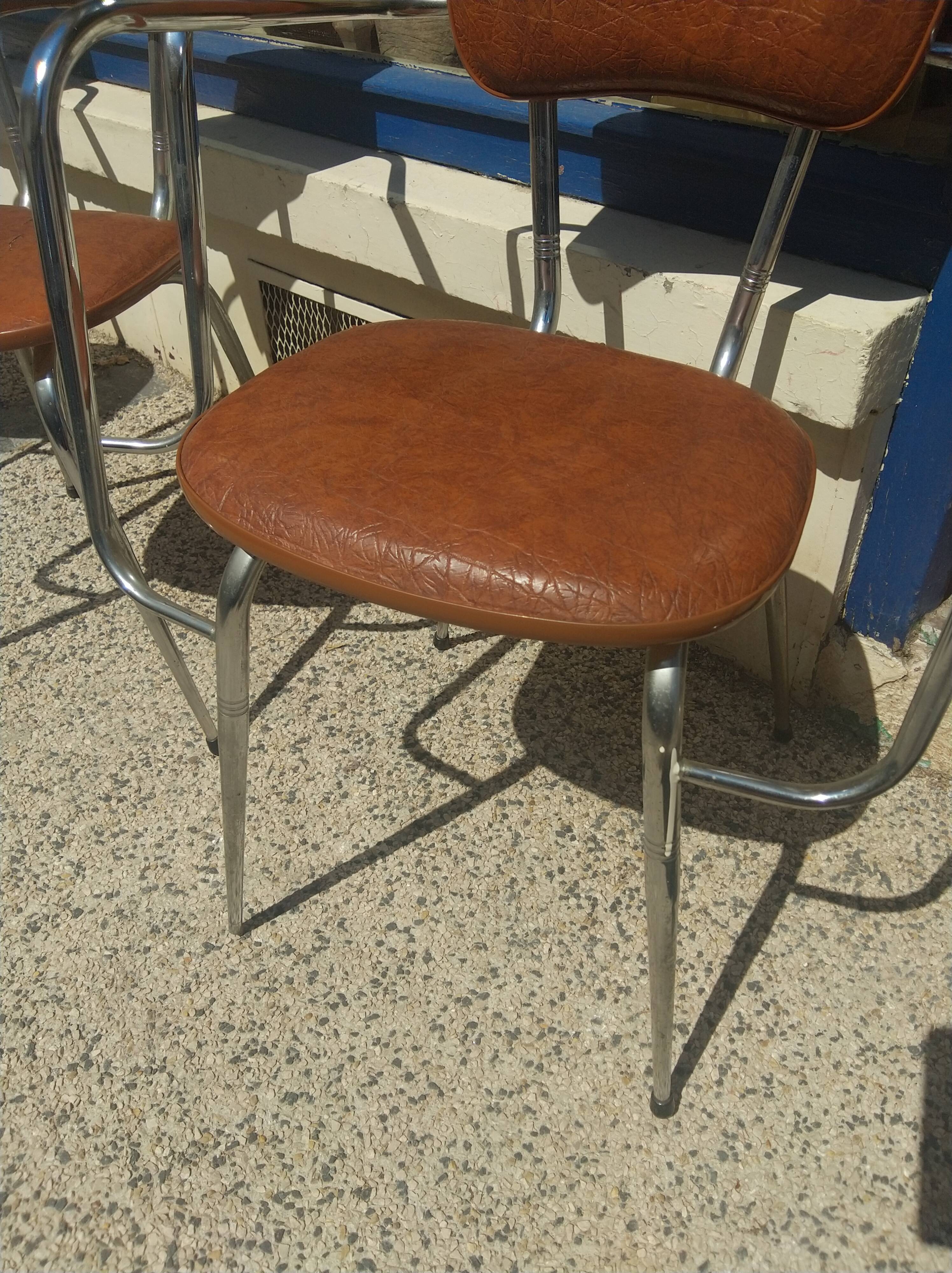Set of 4 armchairs in chromed metal and brown imitation leather, circa 1960