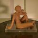 Terracotta sculpture of a seated woman by Norbert Treca contemporary art.