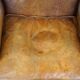 Positively lived-in sheepskin leather wing chair with pleasant seating comfort