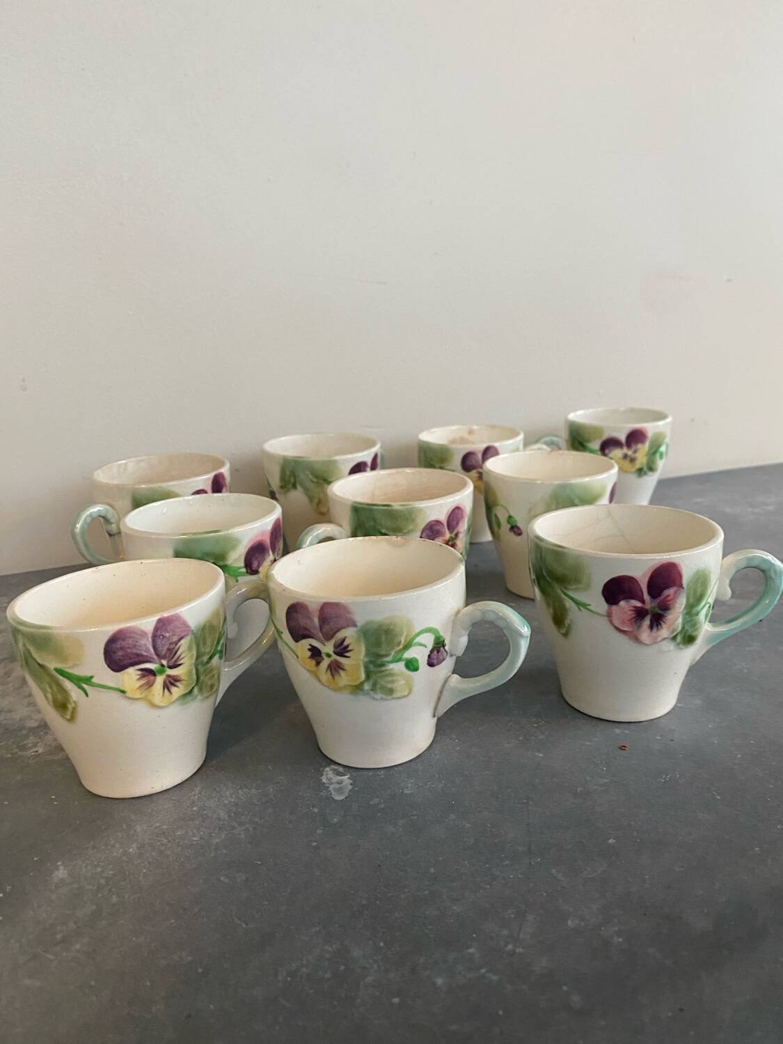 10 slipware cups, pansies