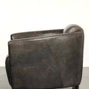 Cow leather Aviator design armchair in a dark colour scheme