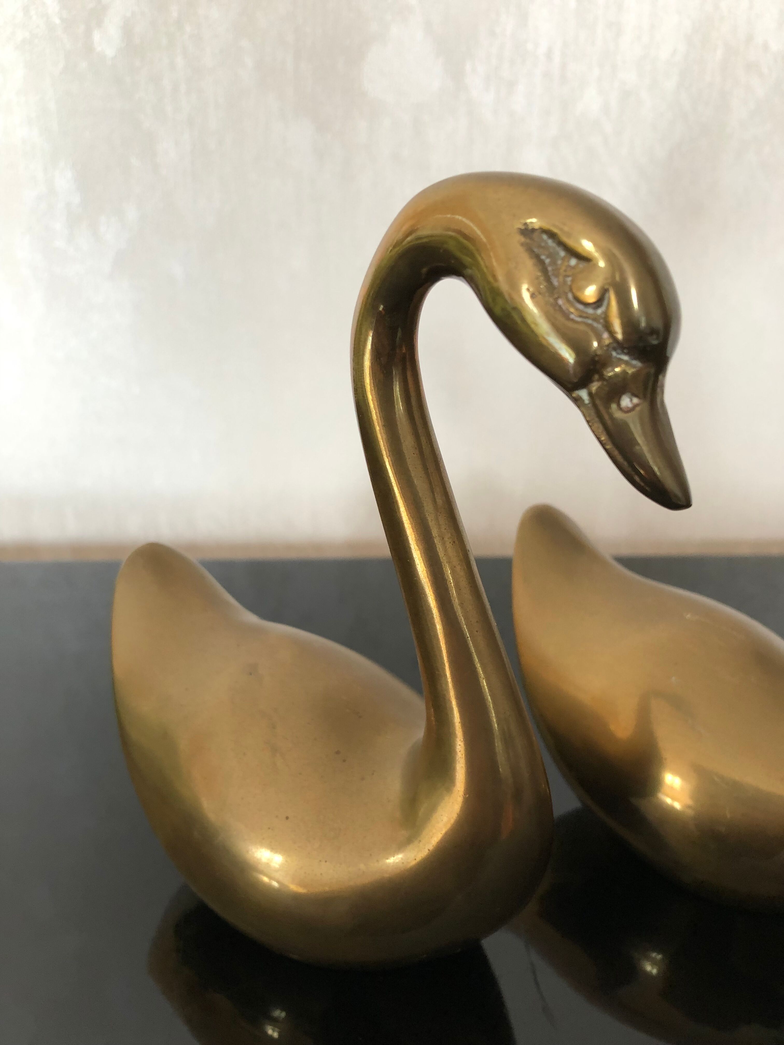 Brass swans