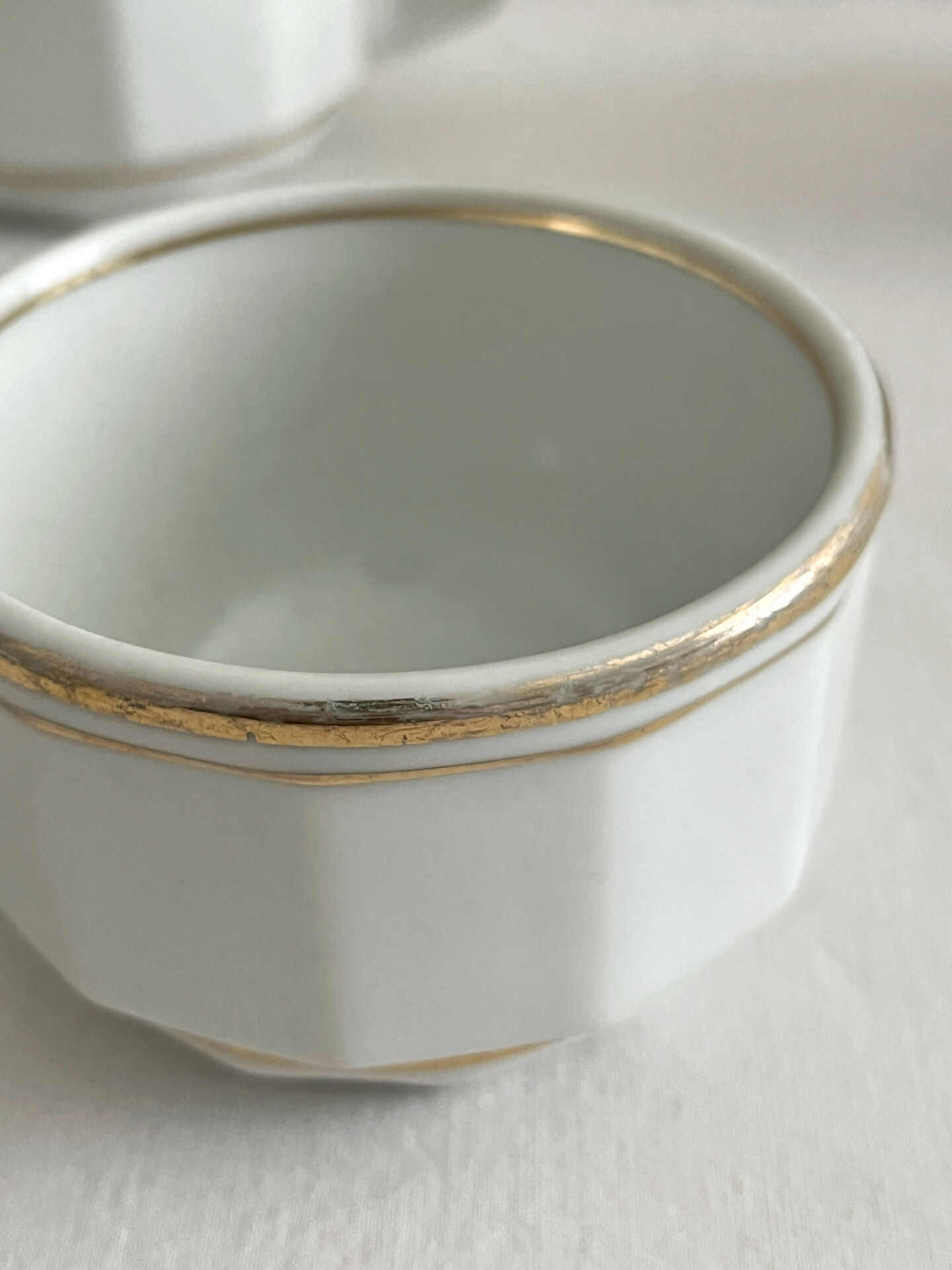 5 vintage porcelain bistro coffee cups from Paris with gold trim.