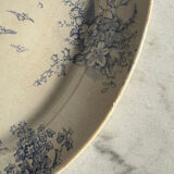 Oval blue presentation plate with birds.