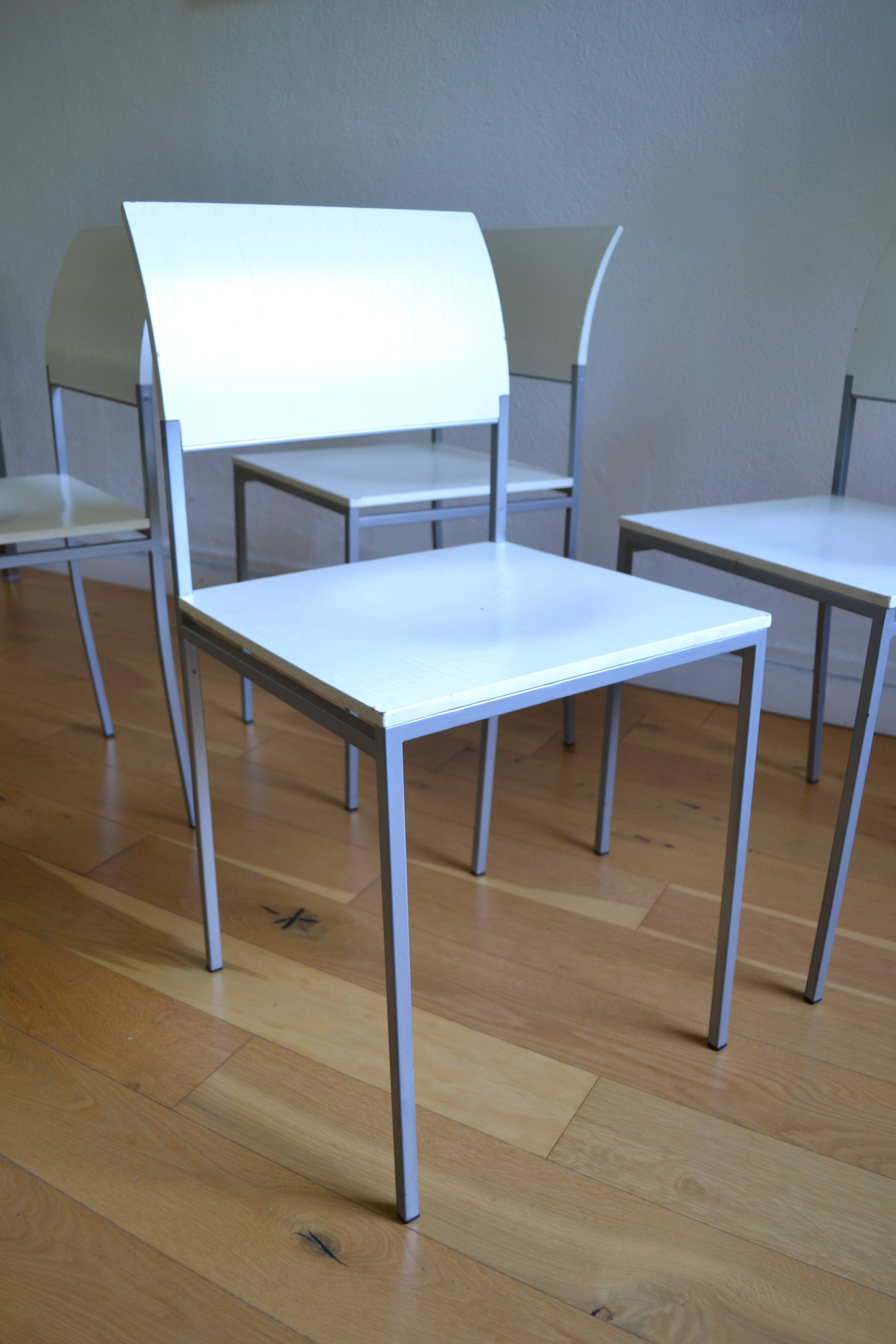 Set of 4 vintage metal and wood chairs from the 1990s.