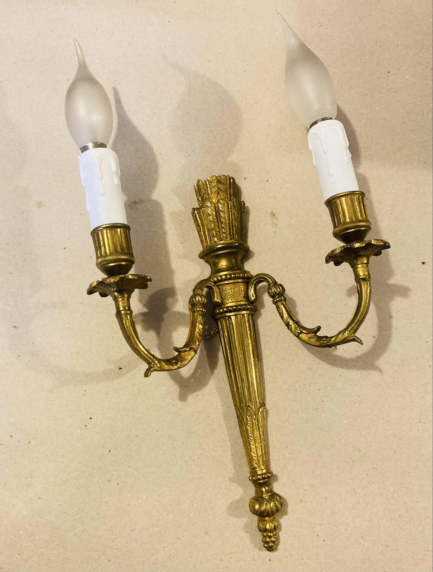 Louis XVI bronze wall sconces from the 19th century with quiver decorations.