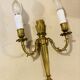 Louis XVI bronze wall sconces from the 19th century with quiver decorations.