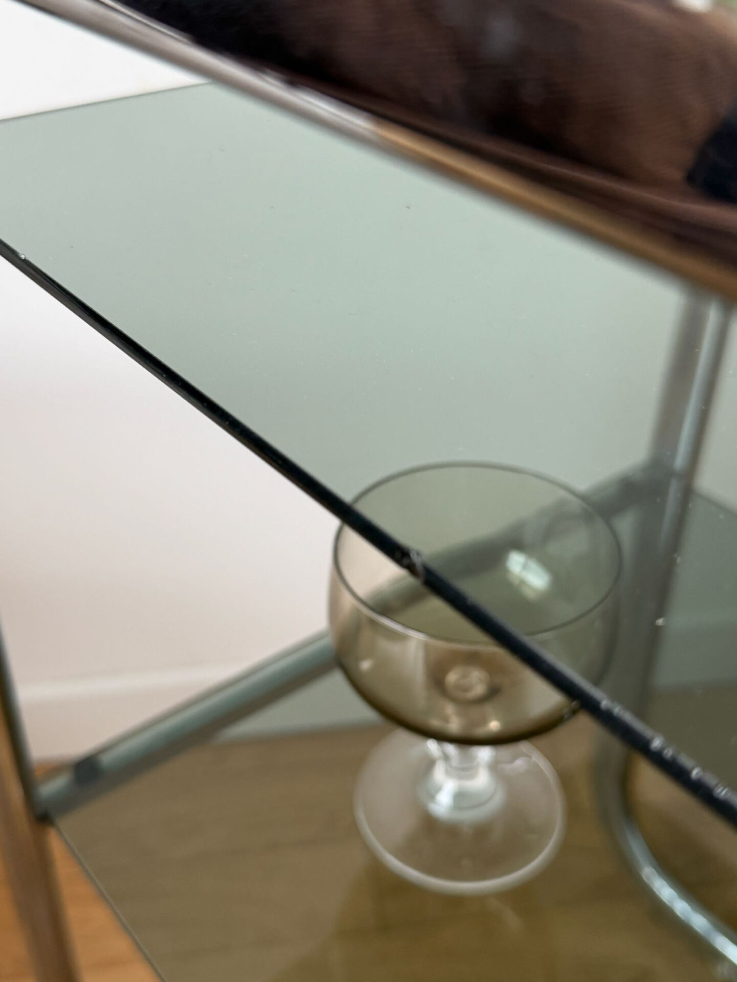 Vintage side table in smoked glass and chrome