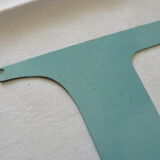 Old letter E painted metal sign