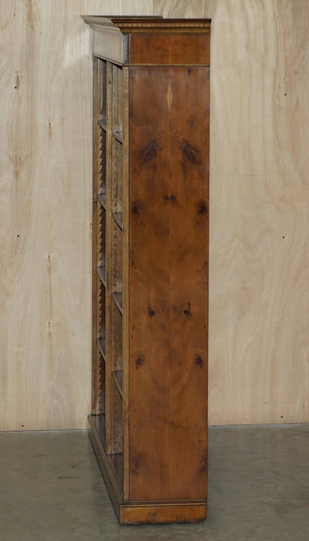 Pair of Sheraton Revival bookcases in satinwood, walnut, and yew.