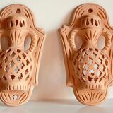 Pair of terracotta wall candle holders