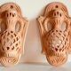 Pair of terracotta wall candle holders