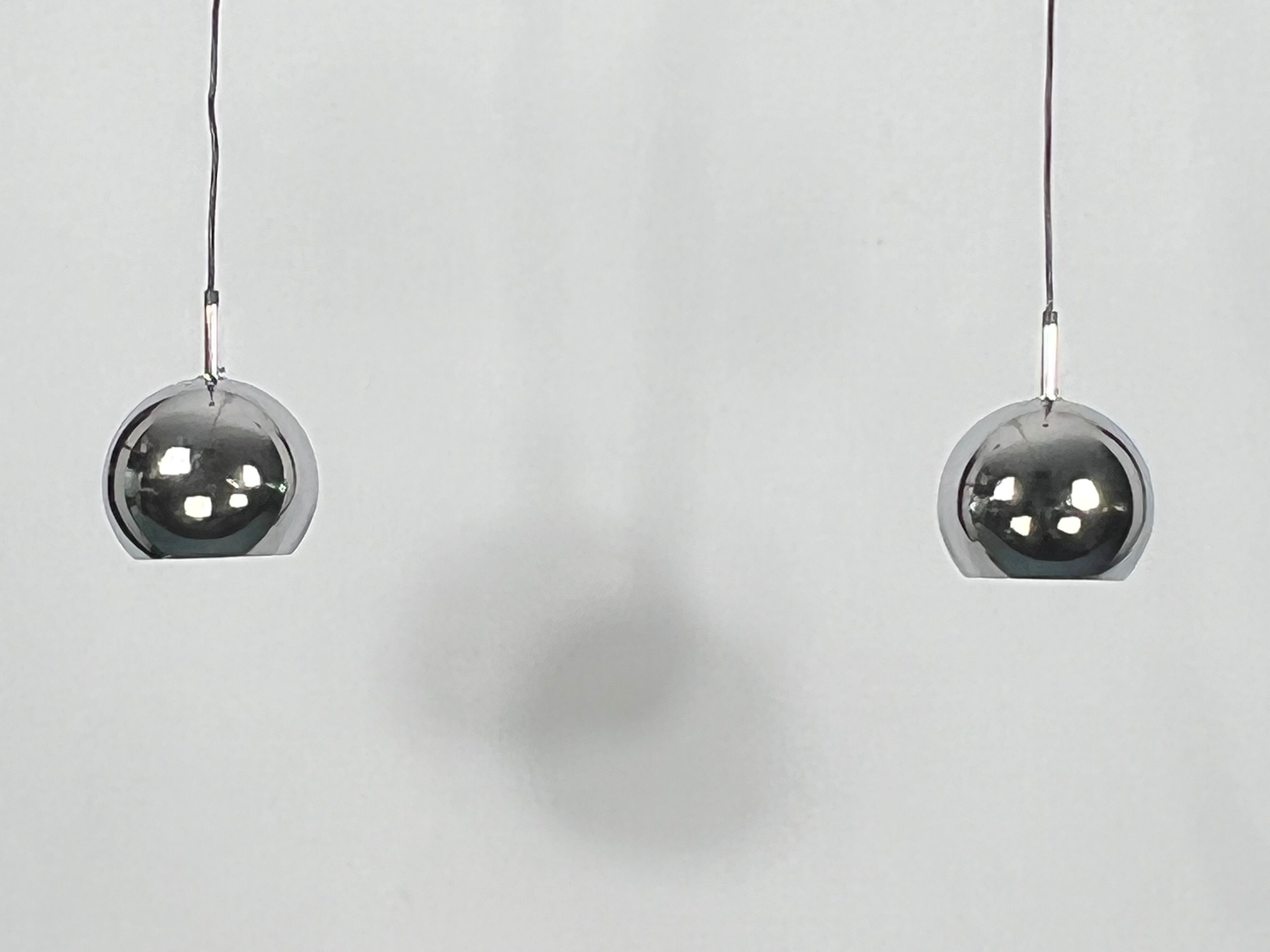 Targetti, set of two chrome sphere pendant lamps from 70s