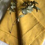 Old linen and cotton sheet tinted in curry yellow