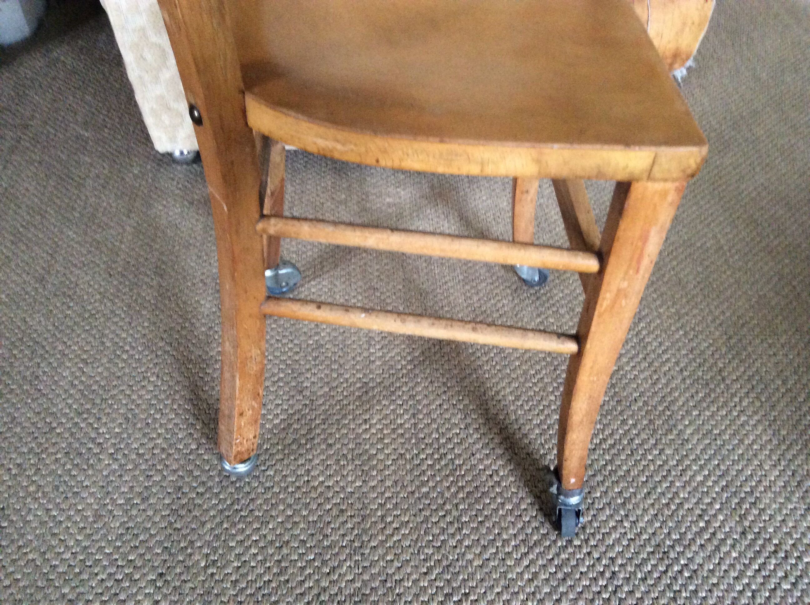 Wooden chair with wheels
