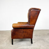 Vintage sheep leather wingback armchair Goor