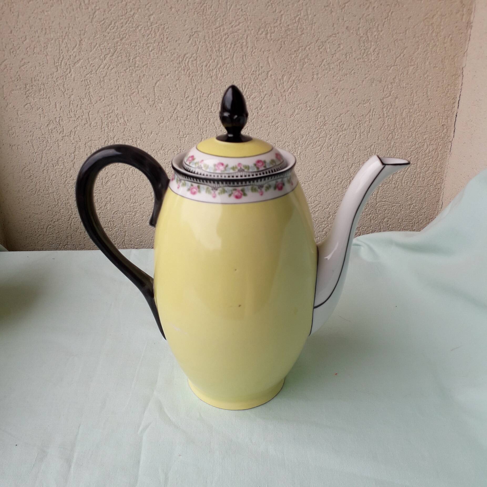 Coffee pot or teapot, sugar bowl and milk jug in porcelain.