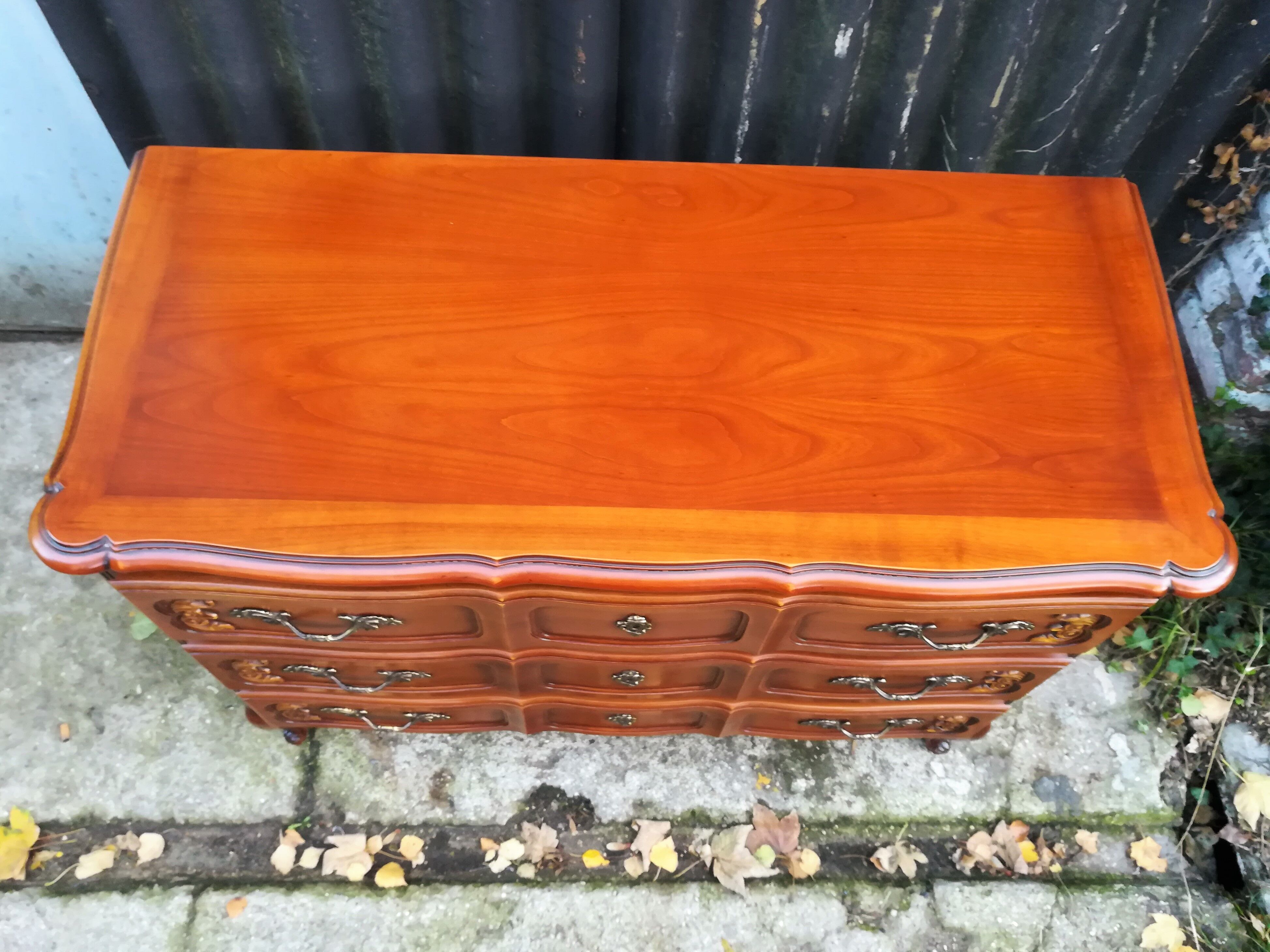 Louis XV style crossbow chest of drawers in cherry wood