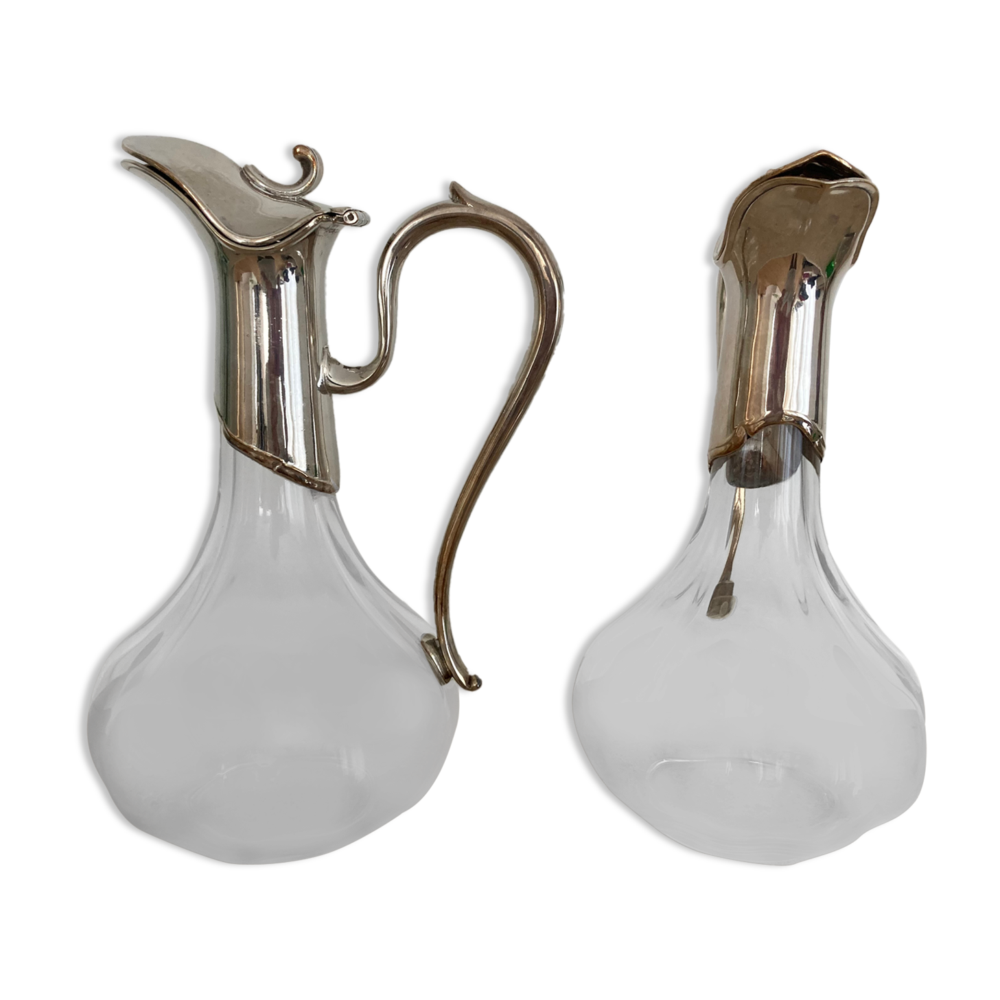 Glass decanters and silver metal spouts