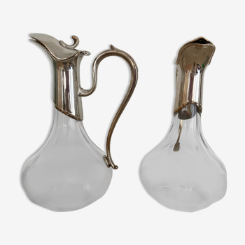 Glass decanters and silver metal spouts