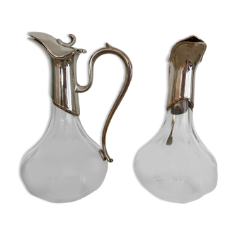 Glass decanters and silver metal spouts