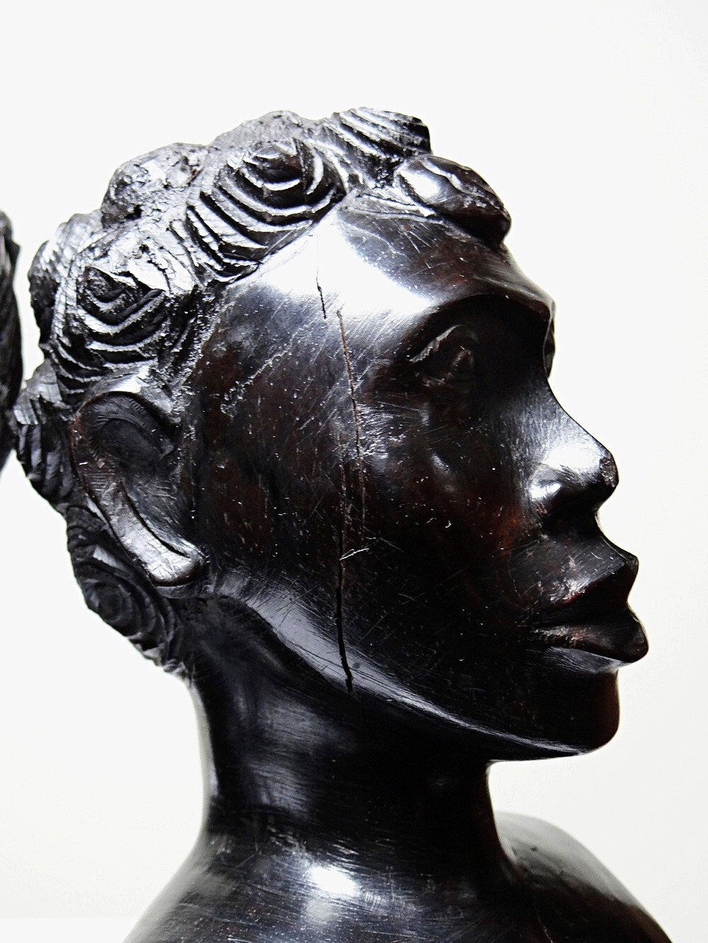 Couple of Malagasy busts in dark exotic wood, carved, craftsmanship from the 1940s to 1970s.