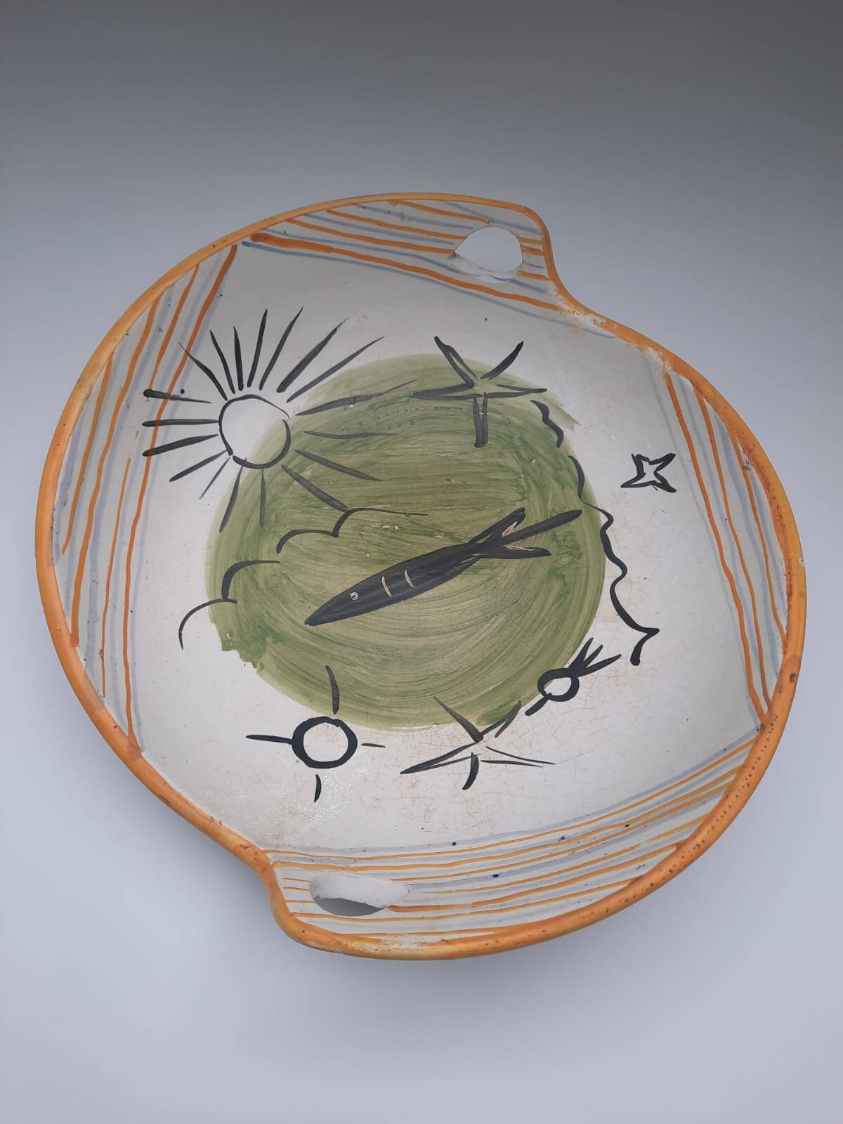 Vallauris 1950 Vintage cup with sun, star, and fish patterns.