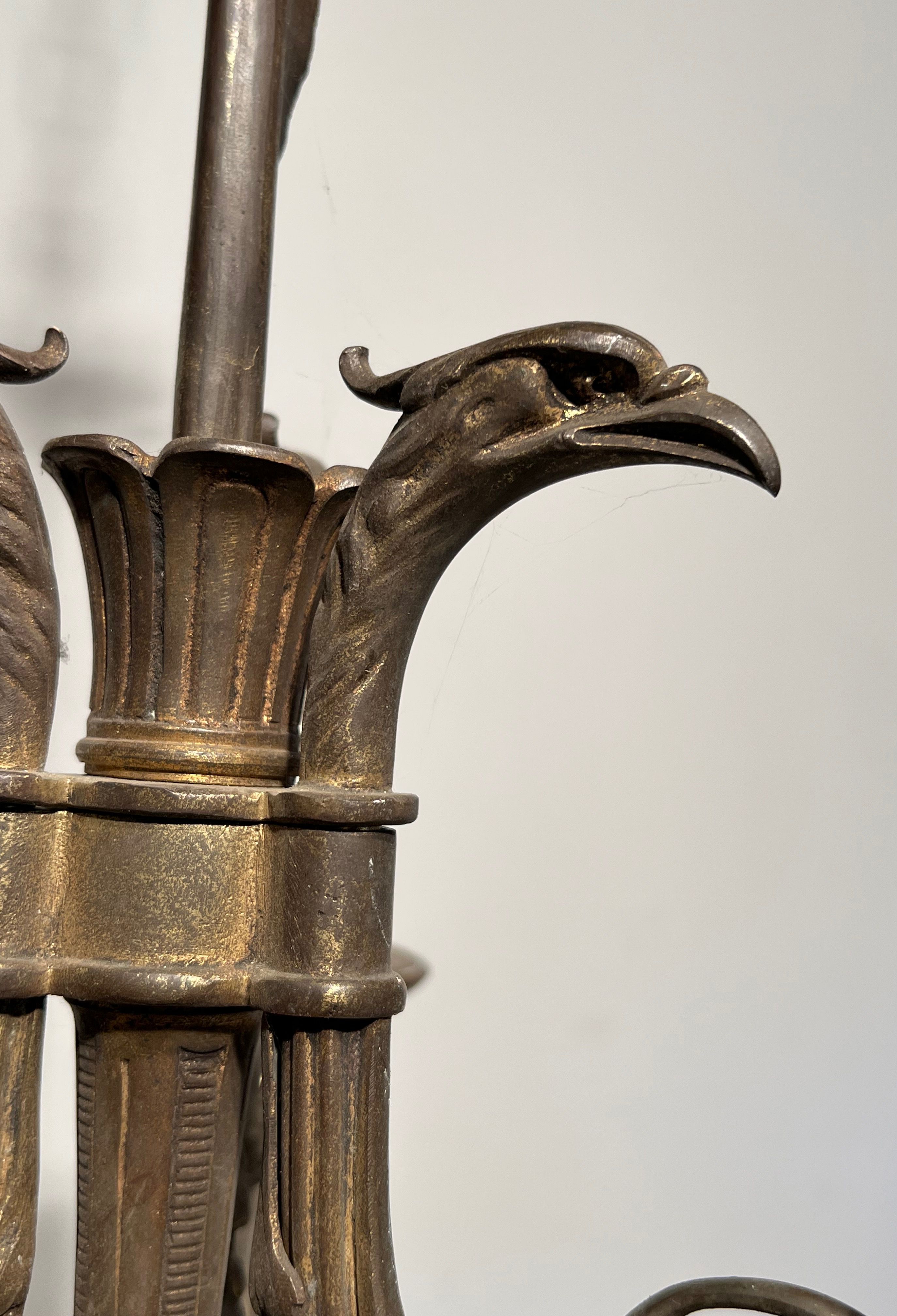 Empire-style bronze chandelier with 3 arms of light topped with eagle heads. French work. Circa 1900.