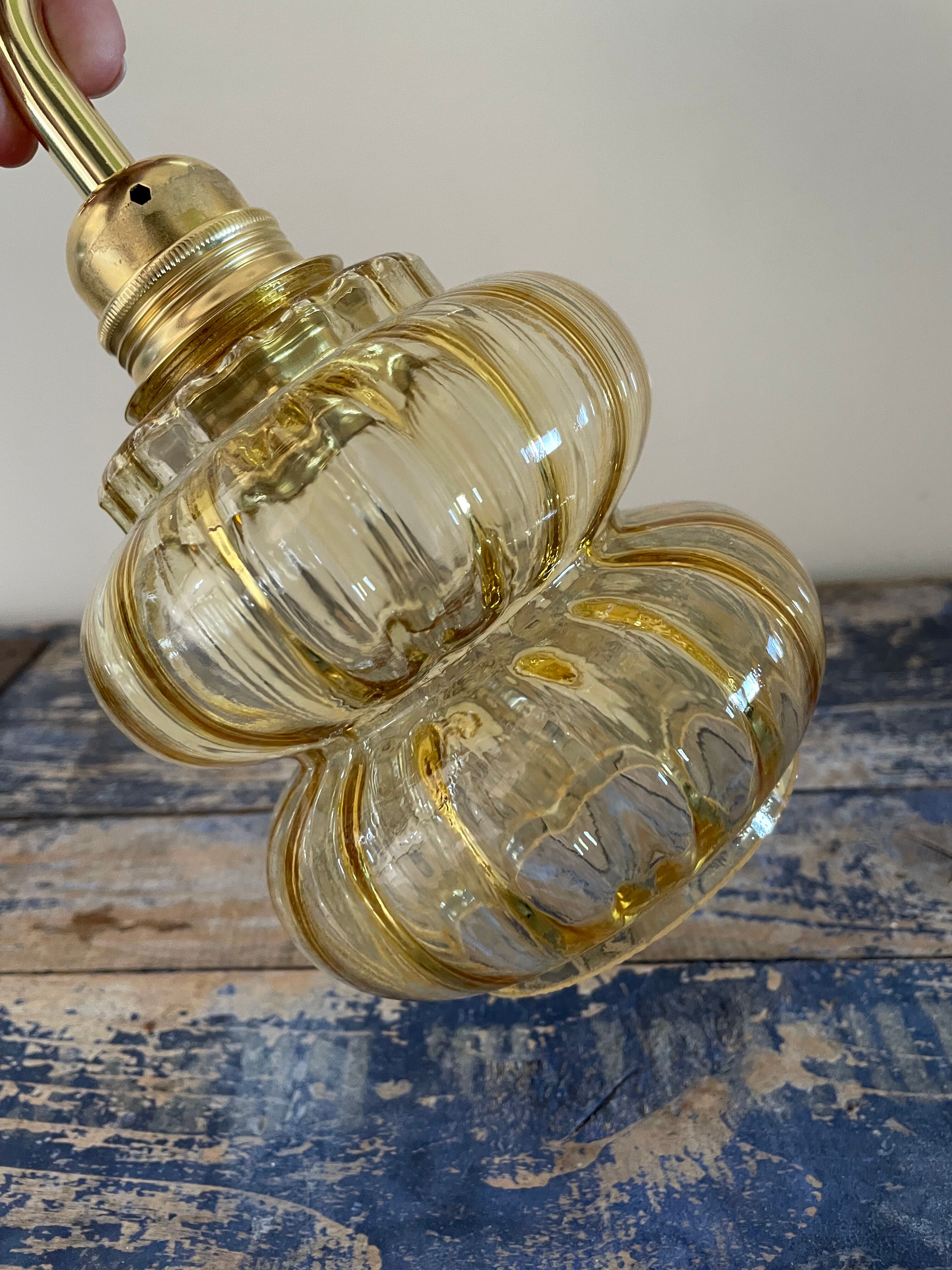 Vintage wall lamp in gilded chiseled glass
