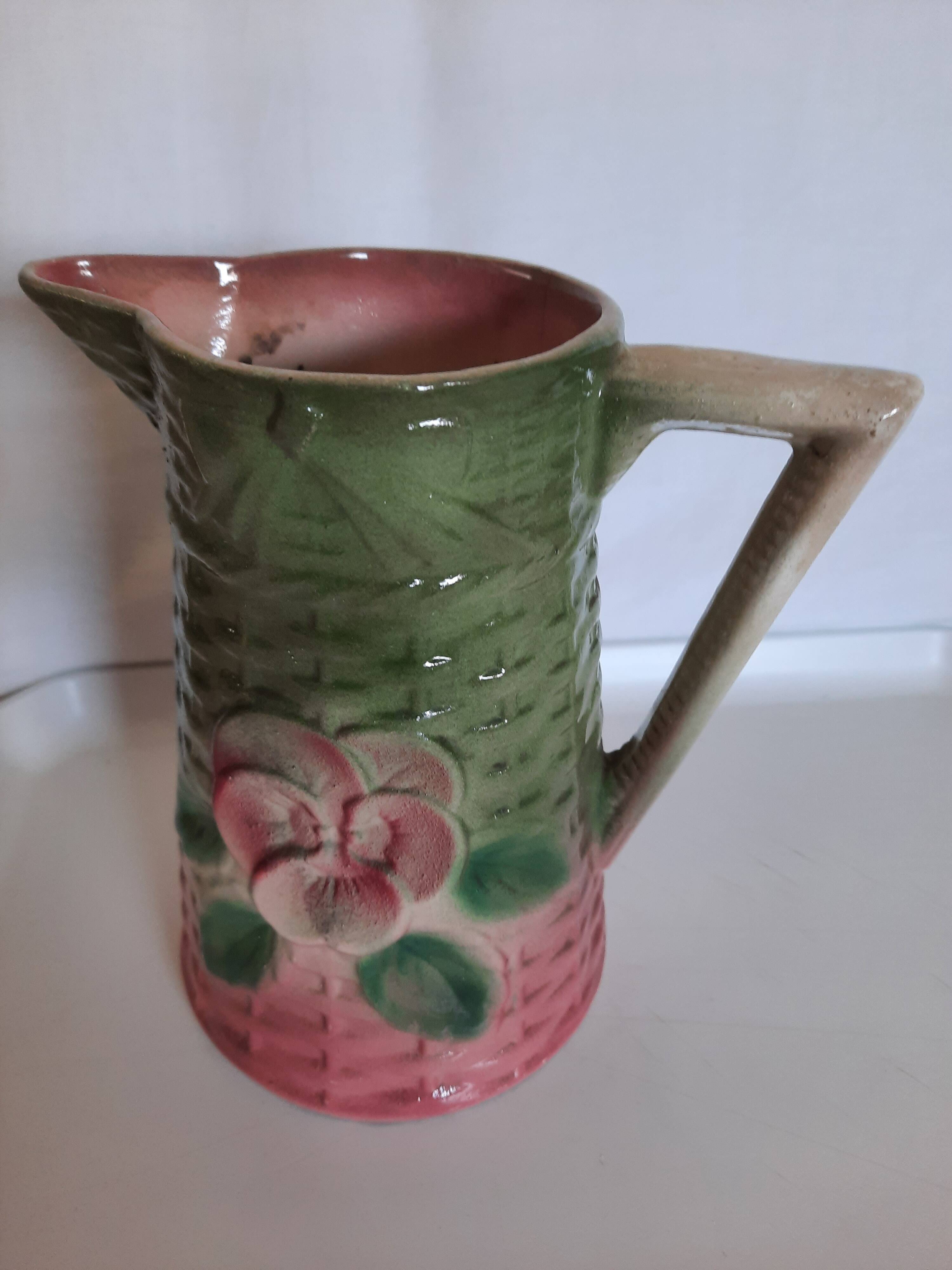 Slush pitcher. Pansy pattern on wicker basket background. Green and pink.