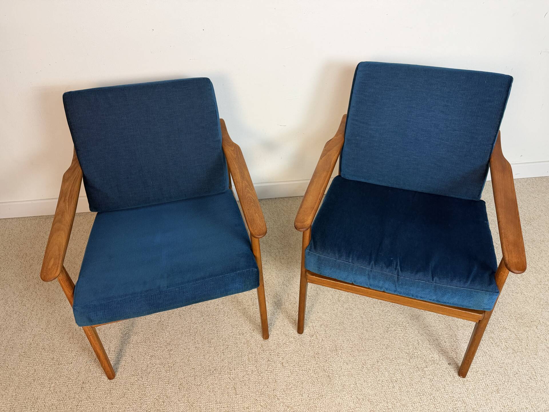 a pair of Scandinavian armchairs in teak from the 1960s