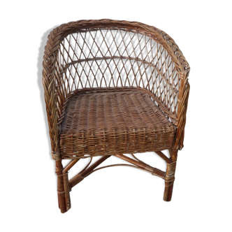 Children's basket chair in vintage braided wicker