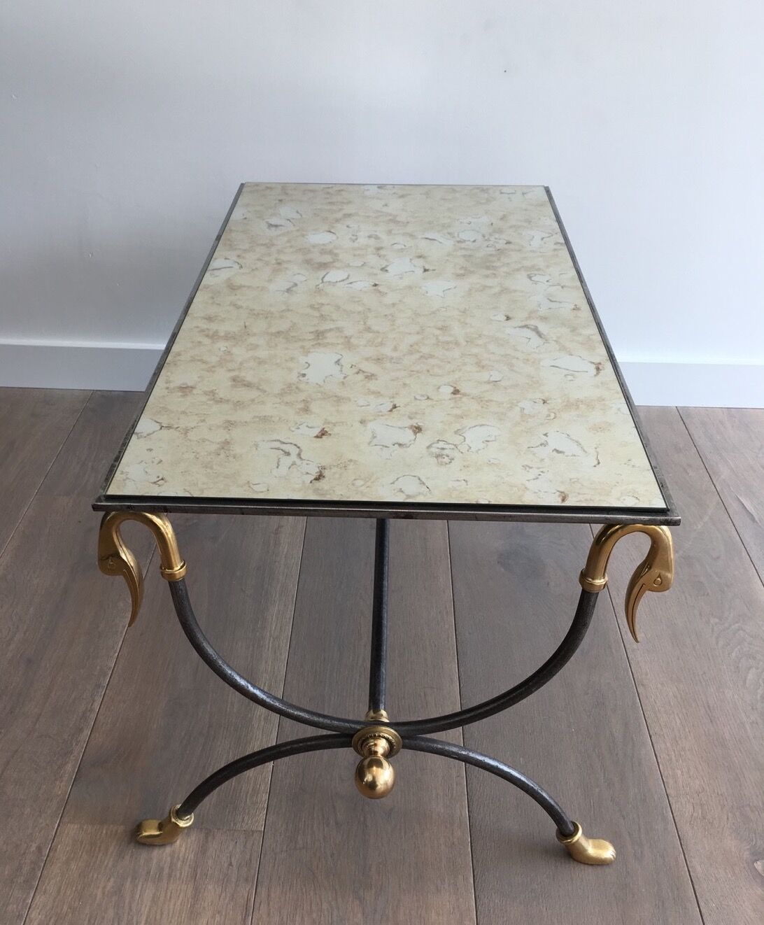 Coffee table in brushed steel and brass