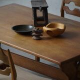 Solid oak dining table with cross base by Danish cabinetmaker, mid-20th century.