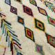 M'rirt Berber rug in cream wool with coloured patterns, 160 × 190 cm