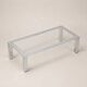 Table basse moderniste en acier chromé et verre clair — Europe, vers 1970