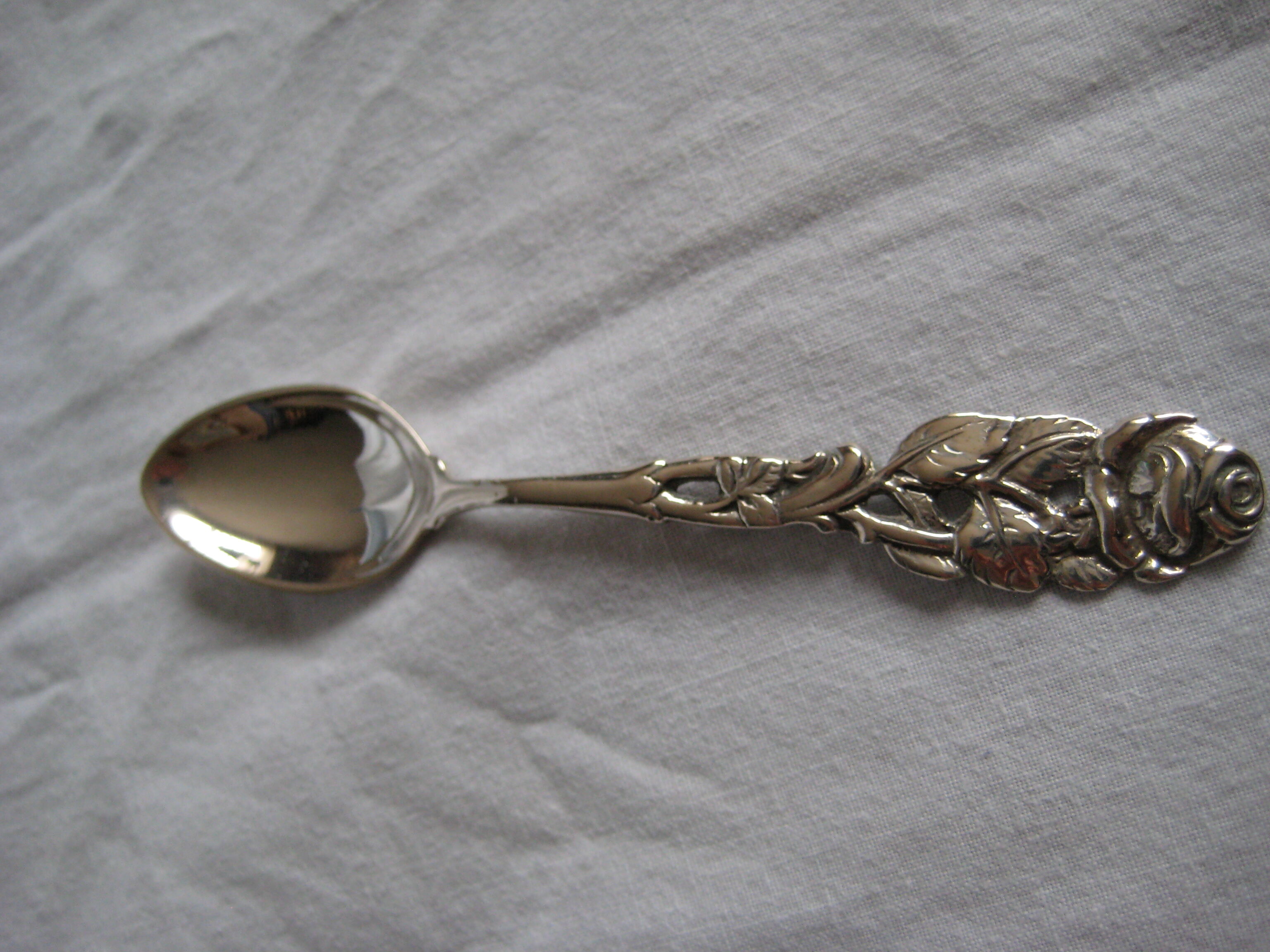 silver metal sugar and silver sugar spoon.