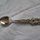 silver metal sugar and silver sugar spoon.