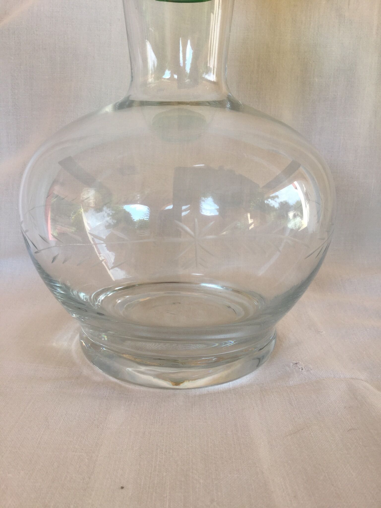 Glass wine carafe with green glass cap