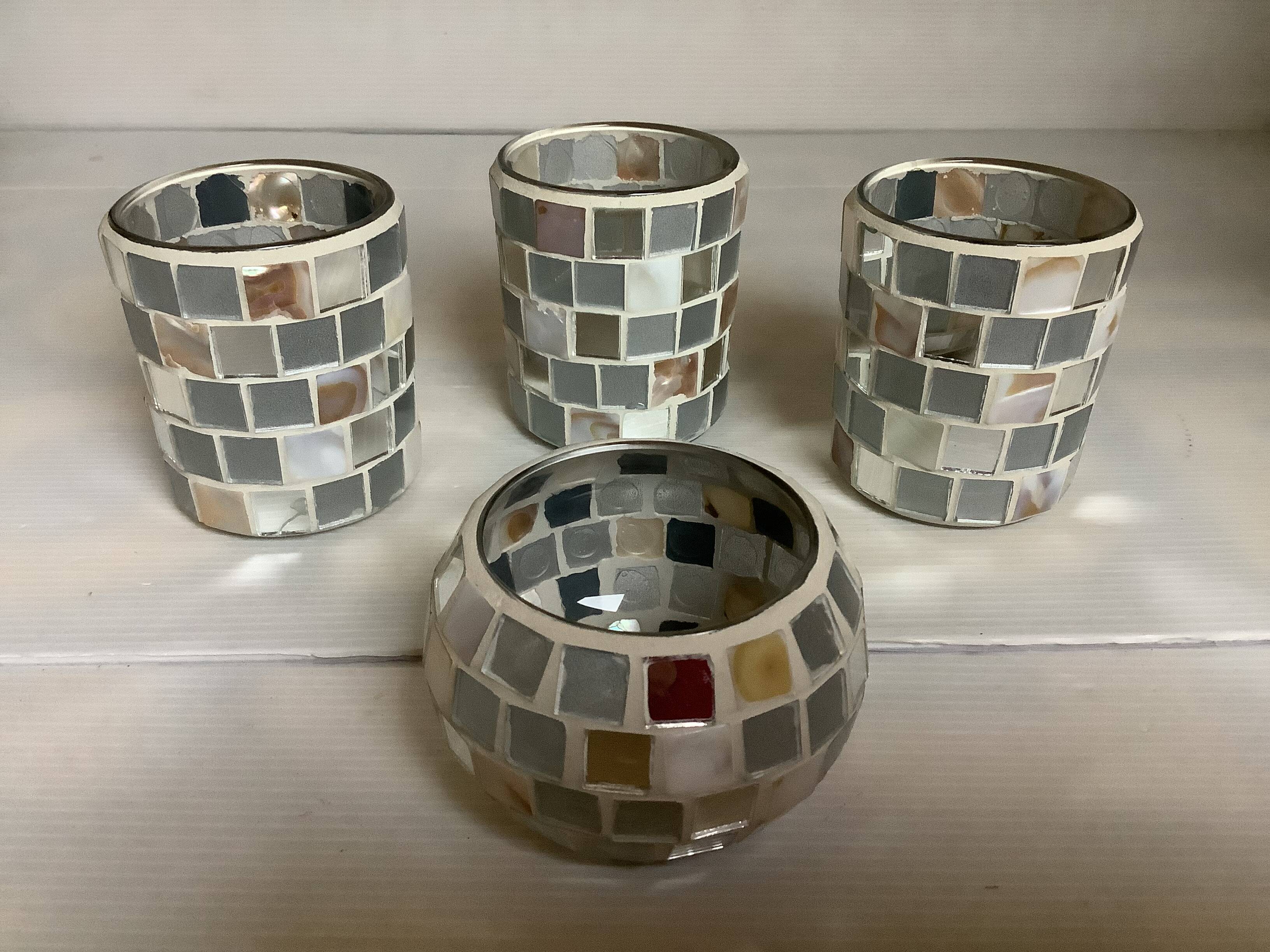 Four mosaic mirror and mother-of-pearl candle holders.