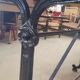 Large bistro table with a wooden top and cast iron legs - 2m56