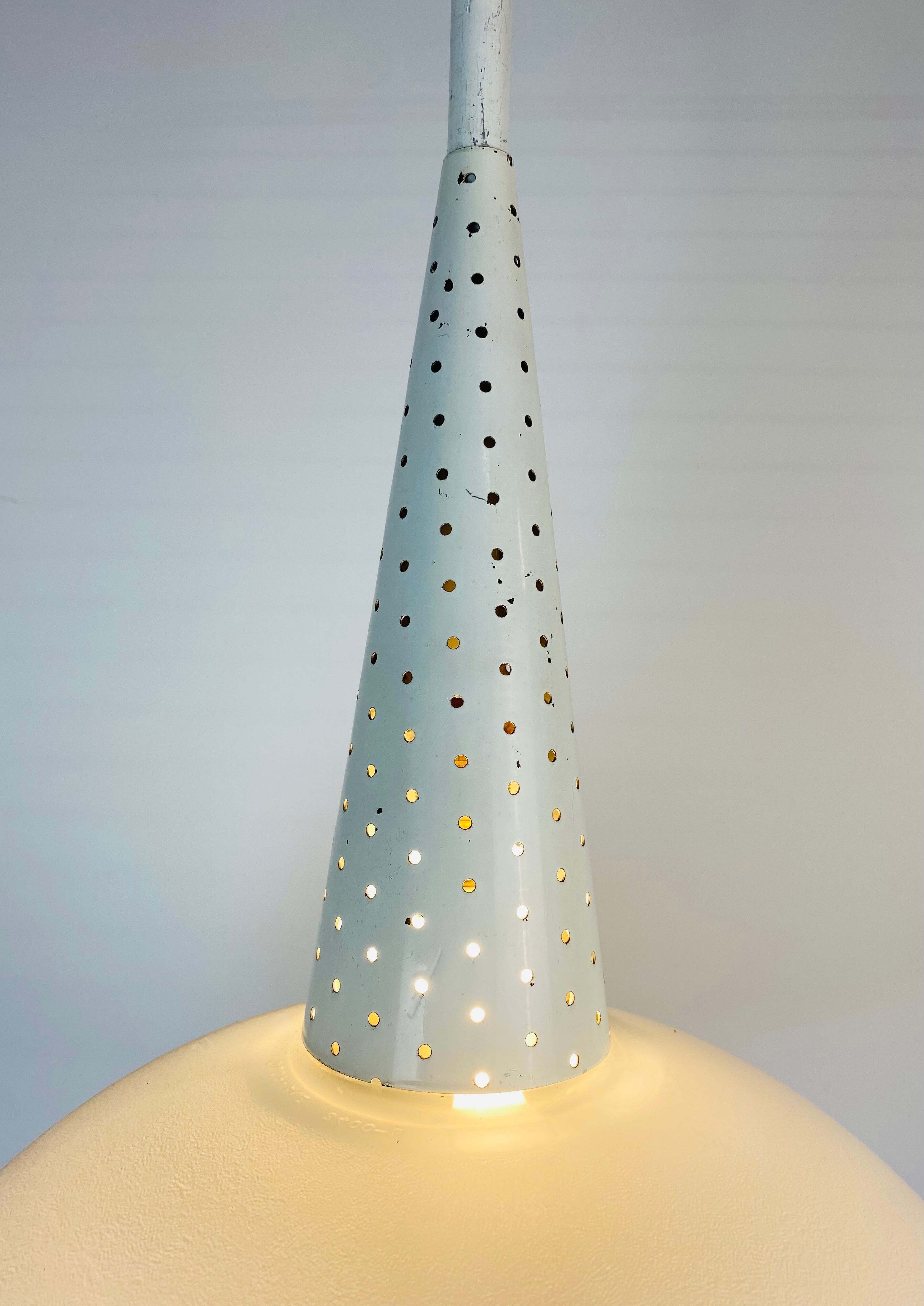 Perforated metal suspension holophanous glass