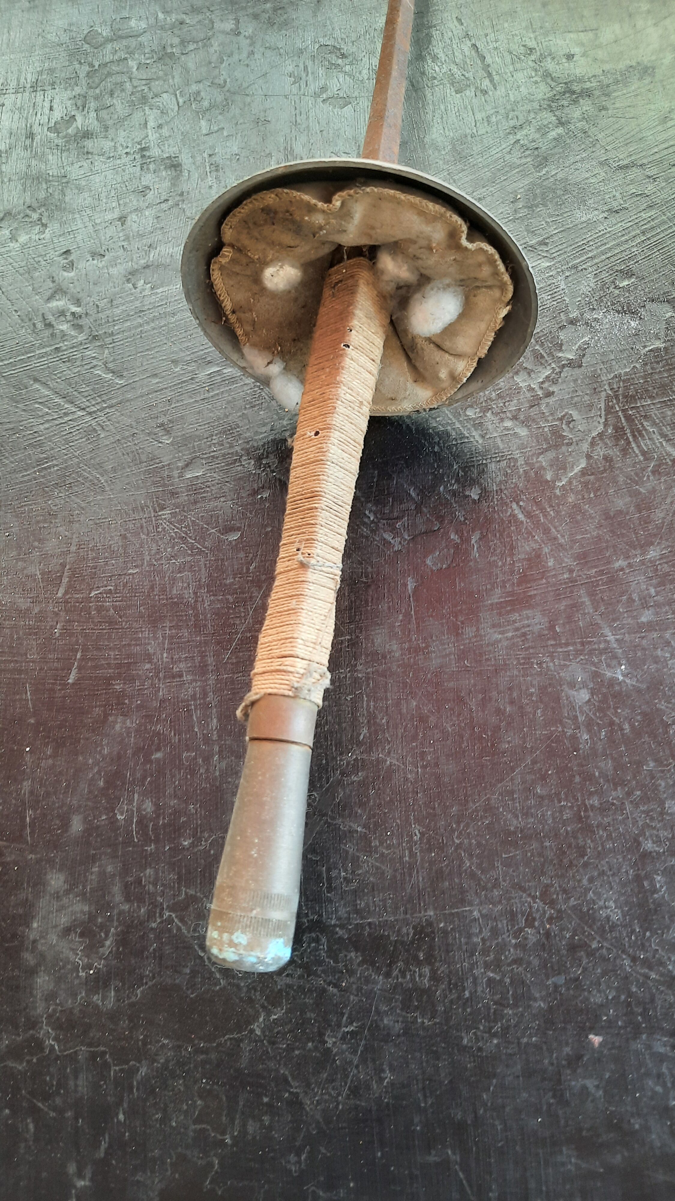 Pair of old fencing mask and foil