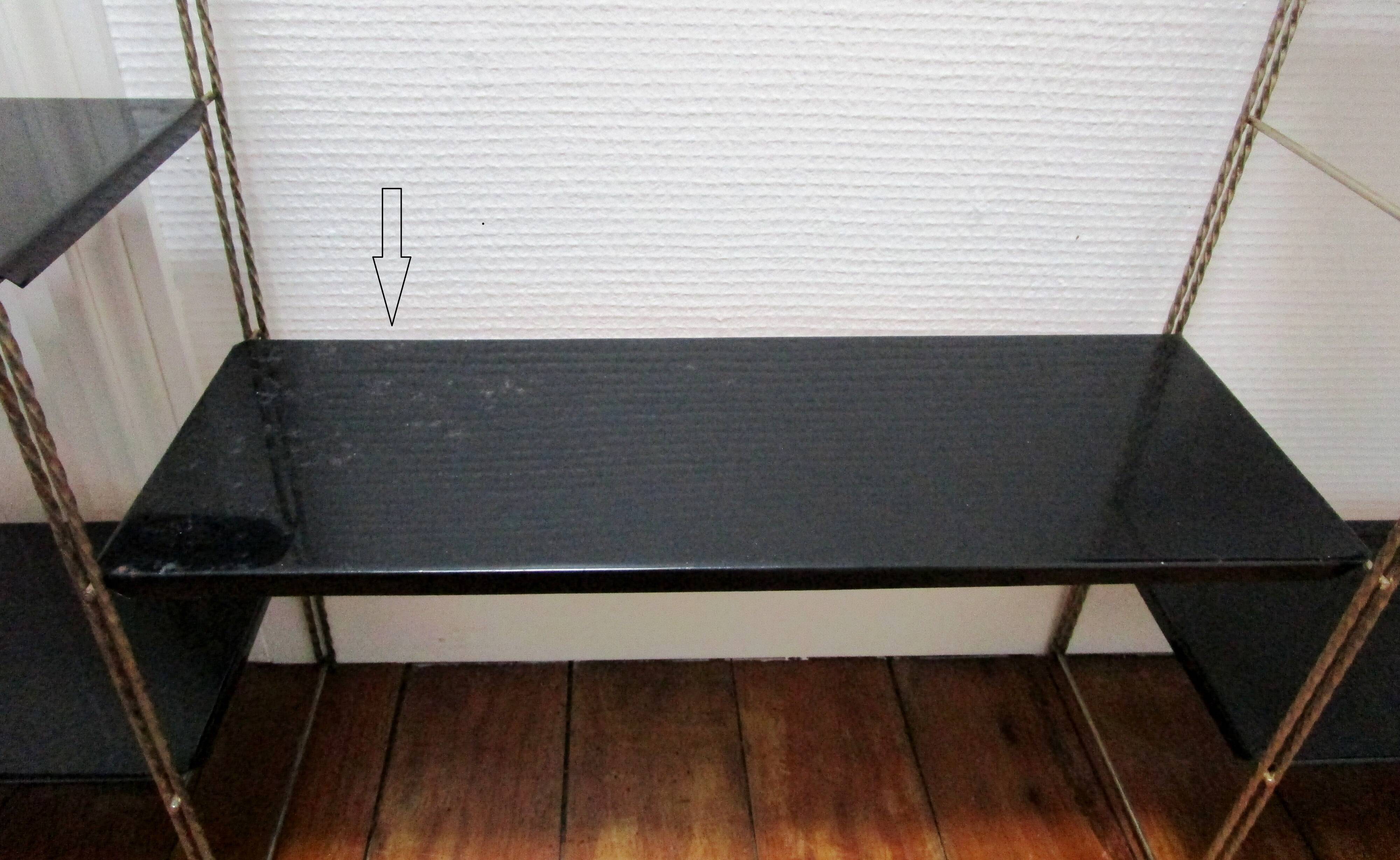 Black and gold metal tomado wall shelf