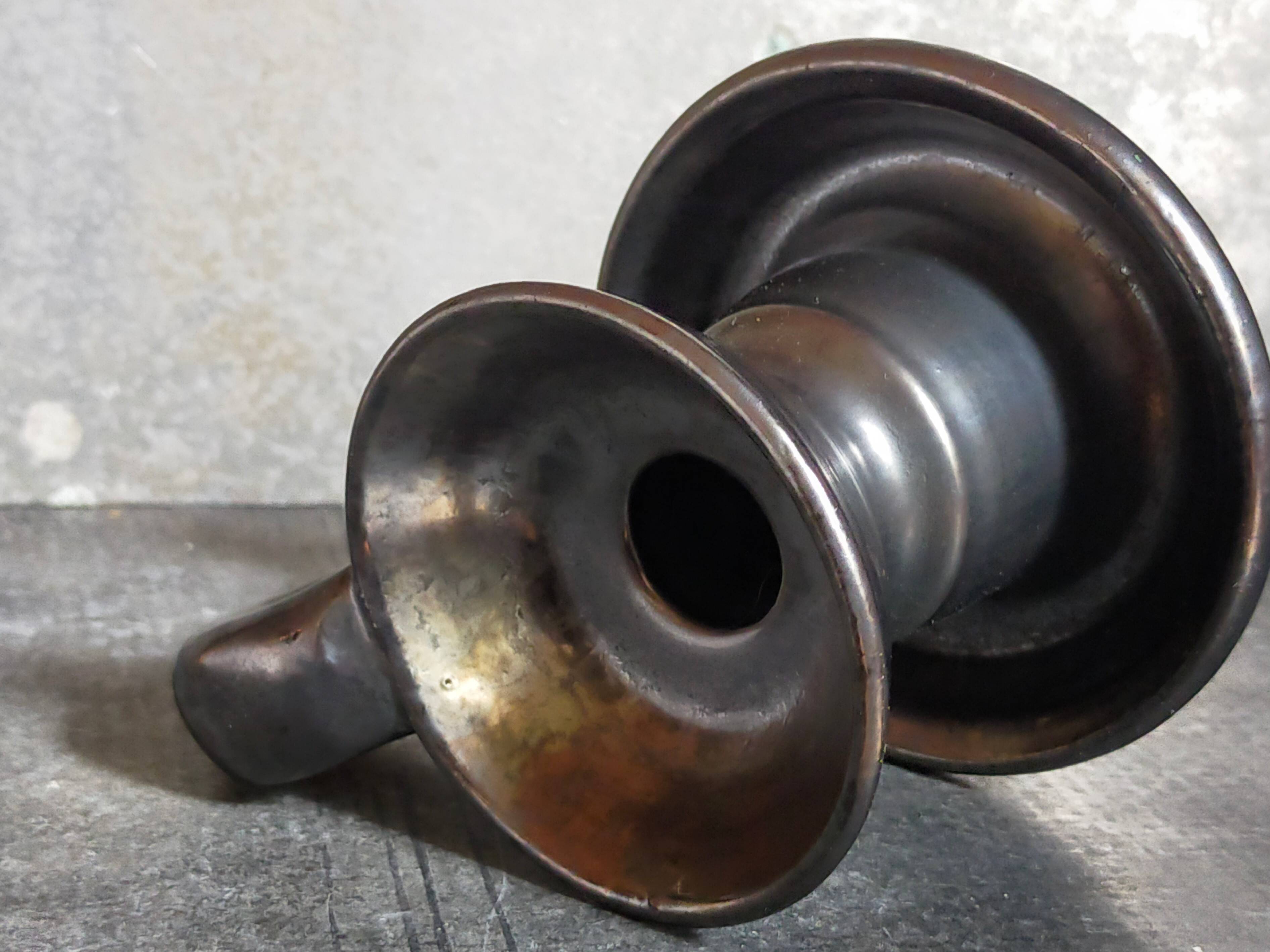 1950s iridescent black ceramic hand candle holder