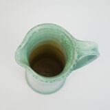 Large green ceramic pitcher with leopard enamel
