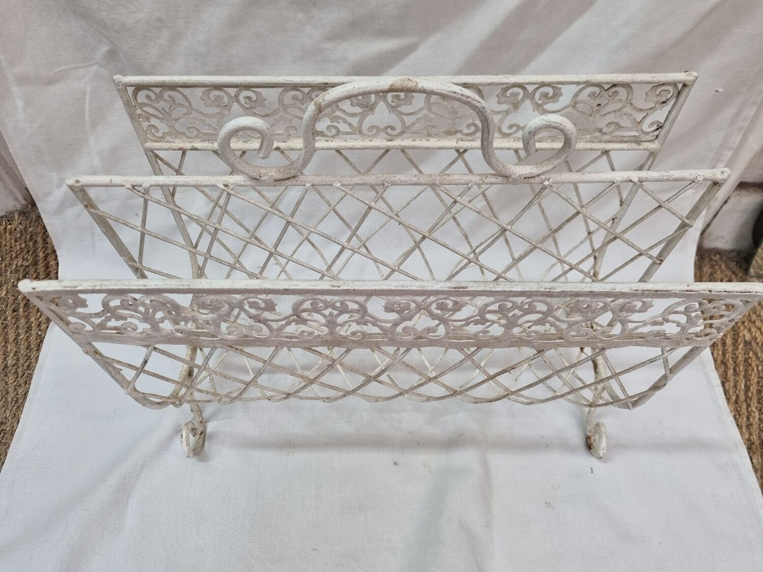 White wrought iron magazine holder