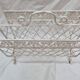 White wrought iron magazine holder