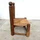 Brutalist chair in wood and straw
