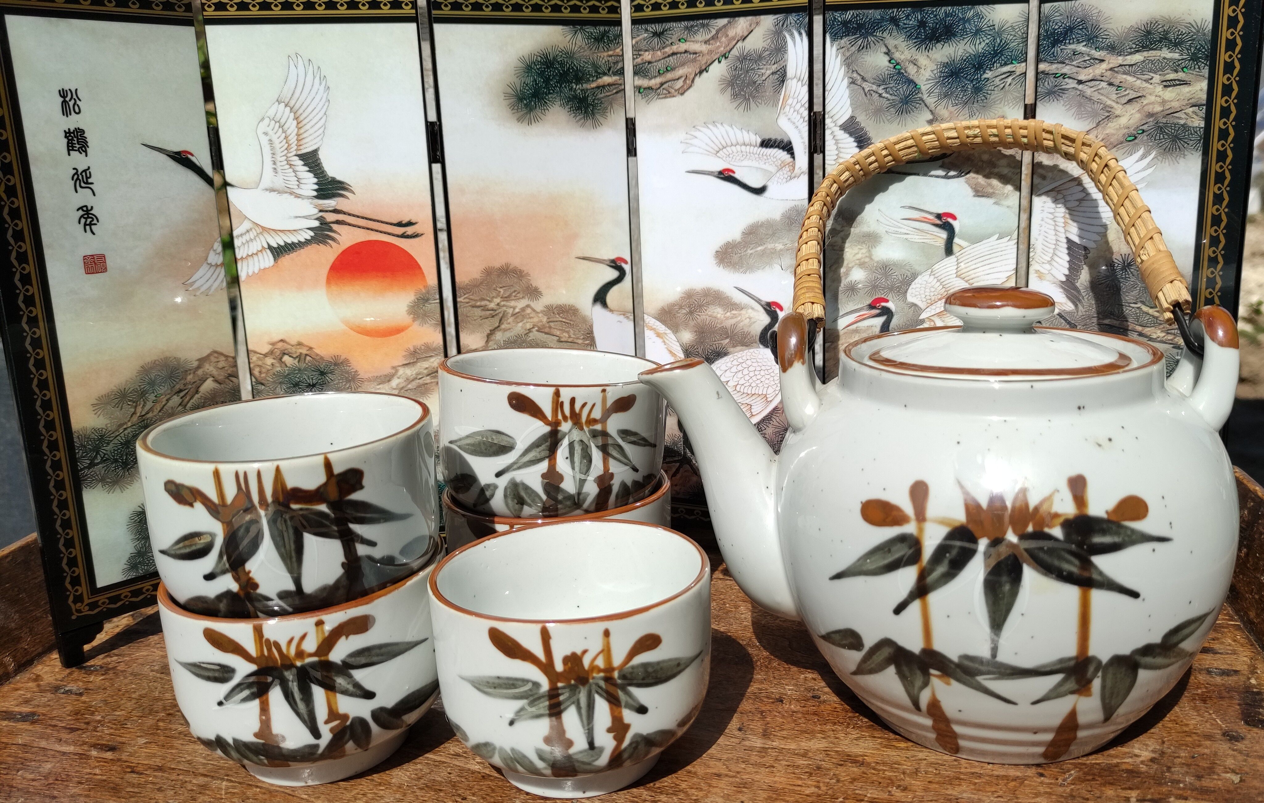 Asian set of a teapot and its cups